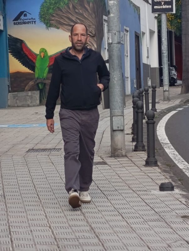 James Roberts walking along a street in Tenerife